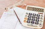 Calculator, Pen And Eyeglasses With Bank Account Passbook Stock Photo