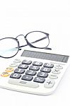 Calculator With Eyeglasses Isolated On White Background Stock Photo