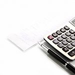Calculator With Pen And Shopping List Stock Photo