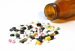 Capsules With Open Bottle  Stock Photo