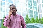 Casual Male Talking On Mobile Phone Stock Photo