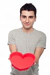 Casual Man Holding Heart Stock Photo