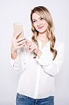 Casual Pretty Woman Taking A Selfie Stock Photo
