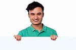 Casual Young Boy Holding Blank Whiteboard Stock Photo