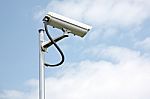 Cctv Camera On Blue Sky Background Stock Photo