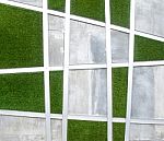 Cement Wall With Artificial Grass Background Stock Photo
