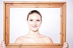 Charismatic Woman In A Wooden Frame Stock Photo