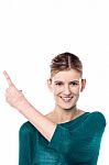 Charming Female Model Pointing Away Stock Photo