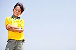 Charming Kid Posing With Folded Arms Stock Photo