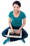 Cheerful Attractive Girl Working On Laptop Stock Photo