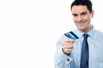 Cheerful Businessman Holding Credit Card Stock Photo
