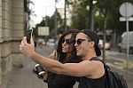 Cheerful Friends Taking Photos Of Themselves On Smart Phone Stock Photo