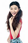Cheerful Girl Posing In Casuals Stock Photo