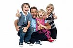 Cheerful Thumbs Up Family Stock Photo