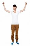 Cheerful Young Boy Celebrating Success Stock Photo