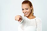 Cheerful Young Lady Pointing You Out Stock Photo