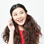 Cheerful Young Woman Talking On Mobile Stock Photo