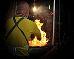 Chef Cook Making A Show With Flames While Cooking In A Night Market Stock Photo