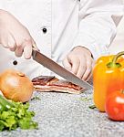 Chef Cutting Bacon Stock Photo