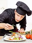 Chef Decorating Delicious Salad Plate Stock Photo