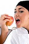 Chef Going To Eat An Apple Stock Photo