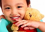 Child Hugging Toys Stock Photo