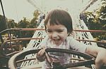 Child In Ferris Wheel Stock Photo
