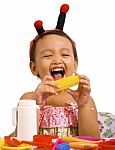 Child Playing With Toy Food Stock Photo