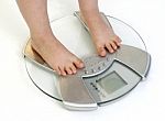 Childs Feet On Weighing Scale Stock Photo