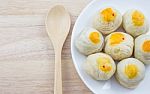 Chinese Pastry Mung Bean Or Mooncake With Egg Yolk On Dish And Wooden Table Spoon Stock Photo