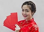 Chinese Woman Holding Red Envelopes Stock Photo