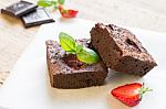 Chocolate Brownie Cake Decorated With Strawberries. Selective Fo Stock Photo