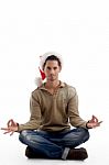 Christmas Guy Doing Meditation Stock Photo