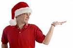 Christmas Hat Wearing Male Looking At Palm Stock Photo