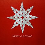 Christmas Snowflake On Red Paper Card Stock Photo