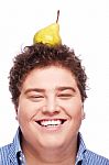 Chubby Boy And Pear Stock Photo