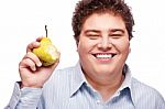 Chubby Boy And Pear Stock Photo