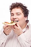 Chubby Man Eating A Slice Of Pizza Stock Photo