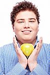 Chubby Man Holding Apple Stock Photo