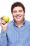 Chubby Man Holding Apple Stock Photo