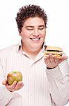 Chubby Man Holding Apple And Hamburger Stock Photo