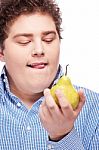 Chubby Man Holding Pear Stock Photo