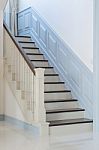 Classic Style Wooden Stair With White Railing Stock Photo