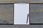 Clipboard And Blank White Paper Stock Photo