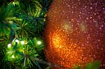 Close Up Big Red Glitter Ball Christmas On Tree With Wire White Light Background Stock Photo