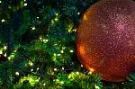 Close Up Big Red Glitter Ball Christmas On Tree With Wire White Light Background Stock Photo