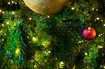 Close Up Big Yellow Glitter Ball Christmas On Tree With Wire White Light Background Stock Photo