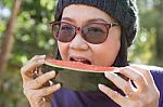 Close Up Face Of Young Woman Earting Water Melon Stock Photo