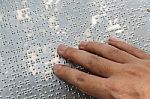 Close Up Hand Reading Braille Stock Photo
