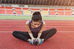 Close Up Of Fit Body Of Sport Girl She Warming Up Before Running Stock Photo